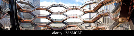 New York - October 10, 2019: The Vessel, landscape panorama view of the elaborate honeycomb like structure rises 16 stories, 154 flights of stairs and Stock Photo