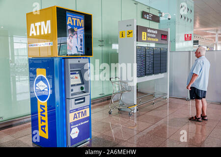 Barcelona Spain,Catalonia Barcelona-El Prat Josep Tarradellas Airport BCN,terminal T1,A,ATM automatic teller machine,real-time flight information boar Stock Photo