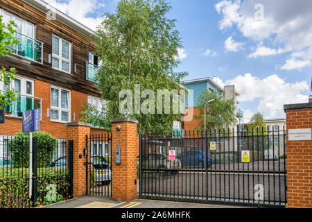 A gated estate in South London with the electronic gate closed. Stock Photo