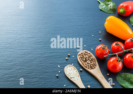 Fresh vegetables and spices from above with negative space for text and graphics. Stock Photo