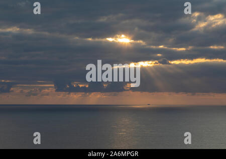 Stunning sunset off the coast at Bedruthan Steps on the North Cornish Coast of Cornwall Stock Photo