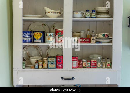 Swift Current, SK/Canada- July 29, 2019: Vintage containers in antique kitchen cupboard Stock Photo