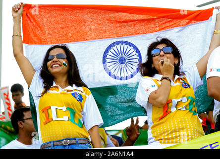 Indian supporters wave their country’s flag during the opening match of the 10th ICC Cricket World Cup, in Sher-e-Bangla National Stadium, on 19th February, 2011.  Mirpur, Dhaka, Bangladesh. Stock Photo