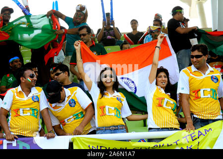 Indian supporters wave their country’s flag during the opening match of the 10th ICC Cricket World Cup, in Sher-e-Bangla National Stadium, on 19th February, 2011.  Mirpur, Dhaka, Bangladesh. Stock Photo