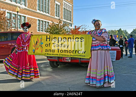 Emporia, Kansas, USA, October 26, 2019 Day of the Dead (Dia de los Muertos) celebration held in Emporia today. Two young girls dressed in traditional Catrina outfits lead off the parade on Commercial street in Emporia Stock Photo