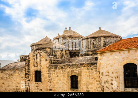 Agia Paraskevi old stone with domes and bell tower Byzantine Church in Geroskipou village, Cyprus Stock Photo