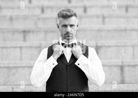 Premium Photo  Bearded man in tuxedo and suspenders. elegant businessman  wear bow tie for formal event. sommelier. true gentleman with groomed hair.  male beauty and fashion. barbershop concept.