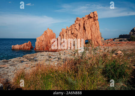 ARBATAX, ITALY / OCTOBER 2019: The scenic red rocks beach in Sardinia, Ogliastra region Stock Photo