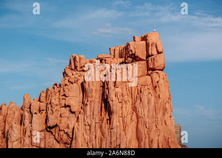 ARBATAX, ITALY / OCTOBER 2019: The scenic red rocks beach in Sardinia, Ogliastra region Stock Photo