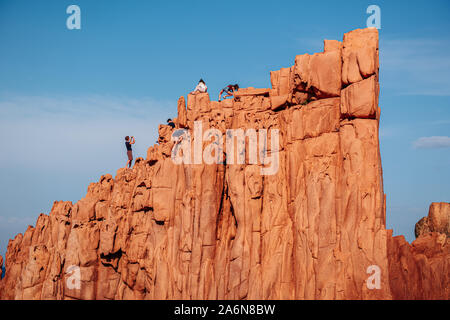 ARBATAX, ITALY / OCTOBER 2019: The scenic red rocks beach in Sardinia, Ogliastra region Stock Photo