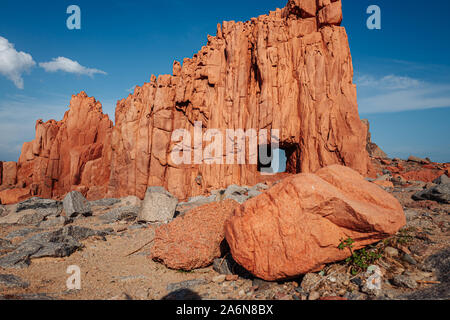 ARBATAX, ITALY / OCTOBER 2019: The scenic red rocks beach in Sardinia, Ogliastra region Stock Photo