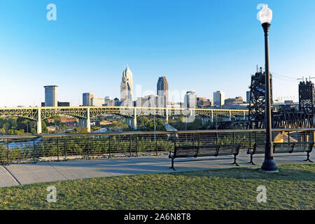 The Cleveland skyline at dusk as viewed from a public park area in the Tremont Ohio City neighborhoods of Cleveland, Ohio, USA.