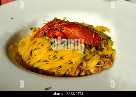 Fettuccine with river prawns and chives. Stock Photo