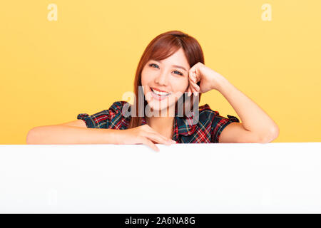 Young Asian woman holding blank billboard  for advertising signs Stock Photo