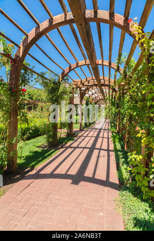 Brick arbor in garden Stock Photo - Alamy