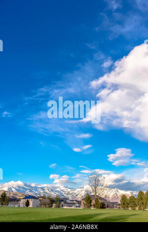 Houses in a town with snow covered mountains Stock Photo