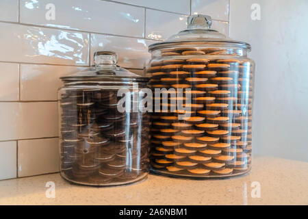 Glass storage jars filled with cookies in kitchen Stock Photo - Alamy