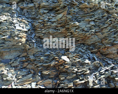 Mountain textured rocky wall with scenic layered stone structure Stock Photo