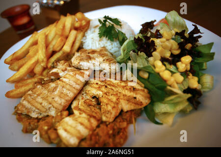 Grilled chicken with vegetables on the dinner plate Stock Photo