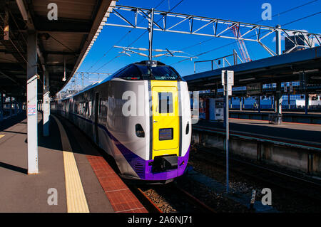 DEC 2, 2018 Hakodate, JAPAN - JR Super Hokuto train stop at Hakodate station platform under bright sunlight in winter Stock Photo