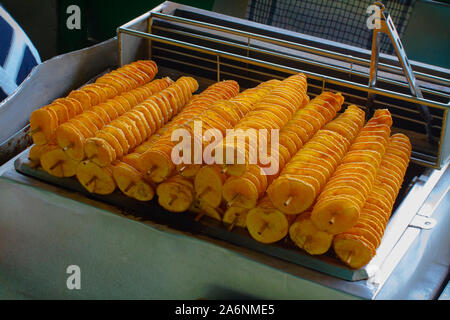 Take away food crunchy spiral fried potatoes at the street food market Stock Photo