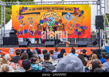 Costumed girls dance on stage at Dia de los Muertos festival, day of the dead, in San Pedro, California Stock Photo