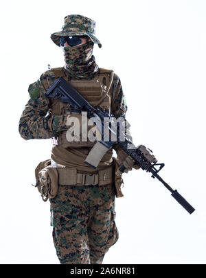 american  marine corps special operations soldier with fire arm weapon and protective army tactical gear clothes Studio shot isolated on white backgro Stock Photo