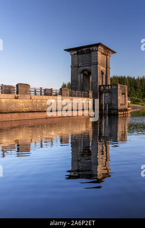 Alwen reservoir dam with reflection, North Wales on a sunny afternoon Stock Photo
