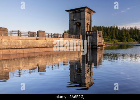 Alwen reservoir dam with reflection, North Wales on a sunny afternoon Stock Photo