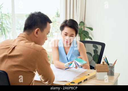 Cheerful two architects are discussing new project Stock Photo