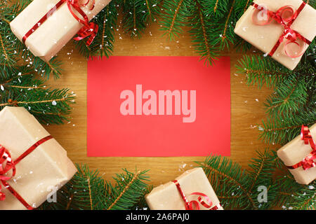 Christmas background with blank notebook surrounded by Christmas decorations. Stock Photo