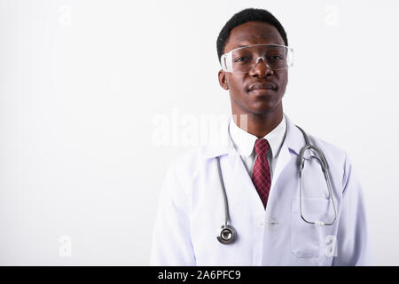 Young handsome African man doctor wearing protective eyeglasses Stock Photo