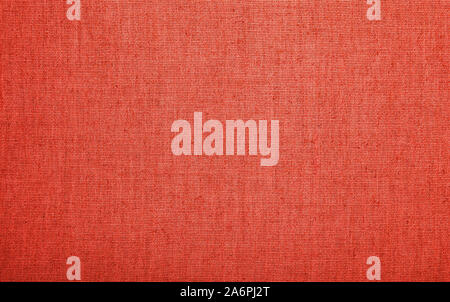 Red and coral pink colored burlap jute sackcloth bagging canvas texture pattern background Stock Photo