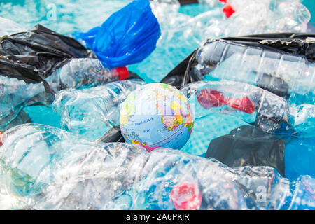 UFA, RUSSIA - JULY 25, 2019 : Problem of trash, plastic recycling, pollution and environmental concept - Plastic rubbish pollution in water Stock Photo