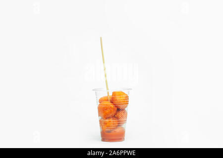 Kwek – Kwek / Tokneneng – a Filipino  tempura-like street food in plastic cup with stick in  white isolated background. Stock Photo
