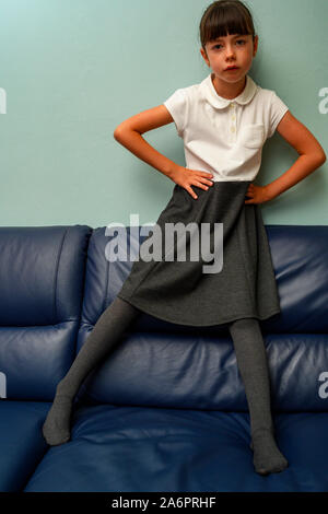 7-year old girl wearing school uniform Stock Photo