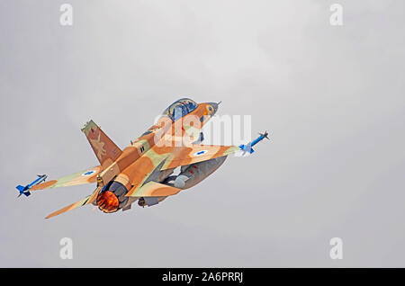 Israeli Air Force (IAF) General Dynamics F-16D in flight with a blue sky background. Stock Photo