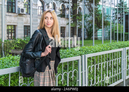 Beautiful female student with a backpack Stock Photo