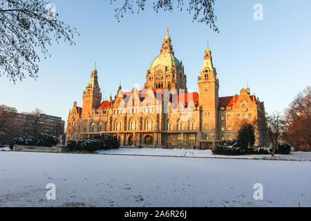 Panorama of the New town hall Rathaus and masch park in winter sunset in Hannover. There is frozen lake. Stock Photo