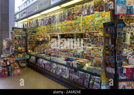 A well stocked news vendor's stall on a main thoroughfare in Palermo. Stock Photo
