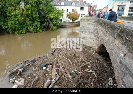 Hereford, Herefordshire, UK - Monday 28th October 2019 - A large amount of assorted river debris is now blocking the centre arches of the old medieval Wye Bridge in Hereford as the River Wye remains high following recent heavy rain upstream. The Wye Bridge is now closed to traffic as the Environment Agency monitor the build up of debris. Photo Steven May / Alamy Live News Stock Photo