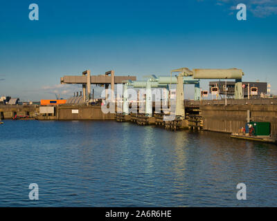 Cardiff Barrage in Cardiff, Wales, UK showing the bascule bridges that can be raised to allow the entry and exit of larger ships. Stock Photo