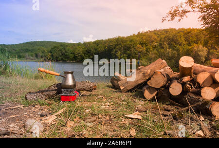 Outdoor coffee making in cezve on primus stove Stock Photo