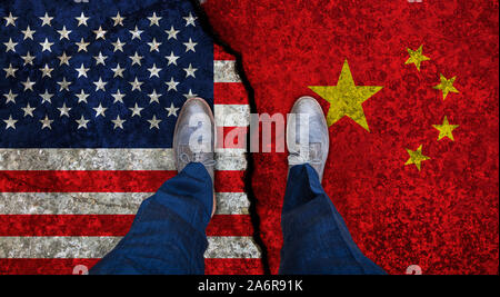 Business man stands on cracked flags of USA and China. Political concept