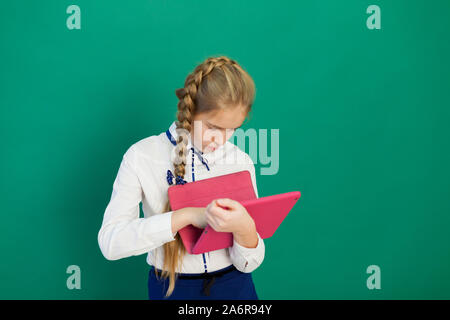 schoolgirl with internet tablet in class class Stock Photo