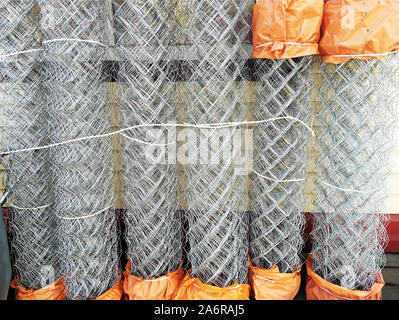 Construction grid a chain-link in rolls. Wicker fence metal bar fence, rabitz, protection Stock Photo