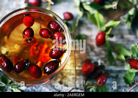 Rosehip or hawthorn. Healthy rosehip tea. Autumn drink. Selective focus. Macro. Stock Photo