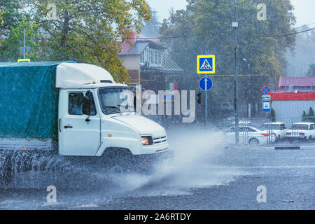 Driving car on flooded road during flood caused by torrential rains. Sochi. Russia. Stock Photo