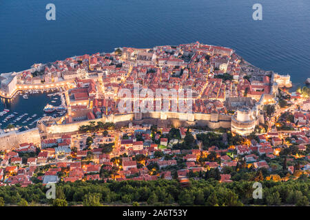 The old town of Dubrovnik, Croatia on a sunny day. As seen from the top of the hill. Visible is the marina, old town and beach. Stock Photo