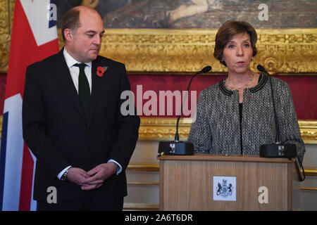 French Ambassador Catherine Colonna, watched by Defence secretary Ben Wallace, speaks during a medal presentation ceremony for the 6000th recipient of the Legion d'honneur, World War II veteran Geoffrey Pidgeon, awarded to him for his role in the liberation of France during World War II, at Lancaster House in London. PA Photo. Picture date: Monday October 28, 2019. See PA story DEFENCE Medal. Photo credit should read: Kirsty O'Connor/PA Wire Stock Photo